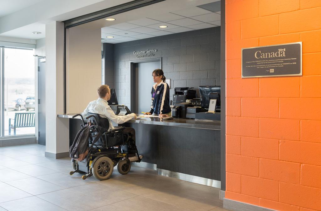 Person using a wheelchair at an accessible service counter