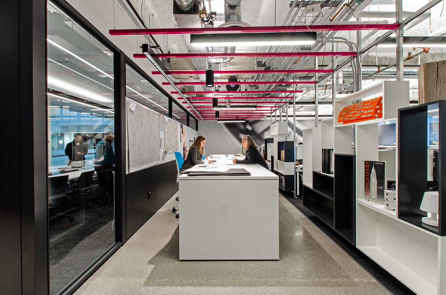 Open concept office with shelving displays.