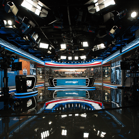 Sportsnet tv broadcast production studio showing the studio set with desks, screens and professional lighting