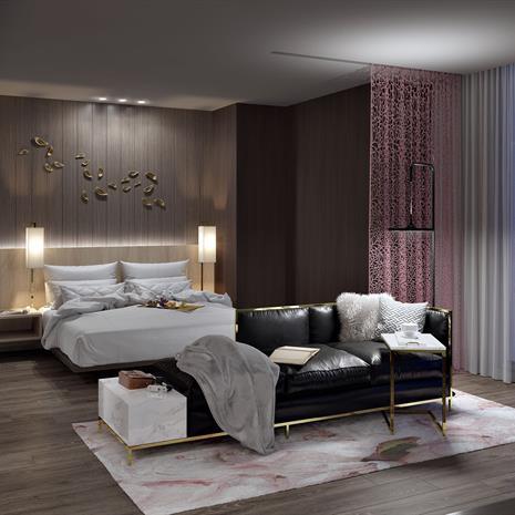 a luxurious hotel suite with generous clearances, pink floral wallpaper and rug, dark wood flooring and walls and floor-to-ceiling windows overlooking a city at night