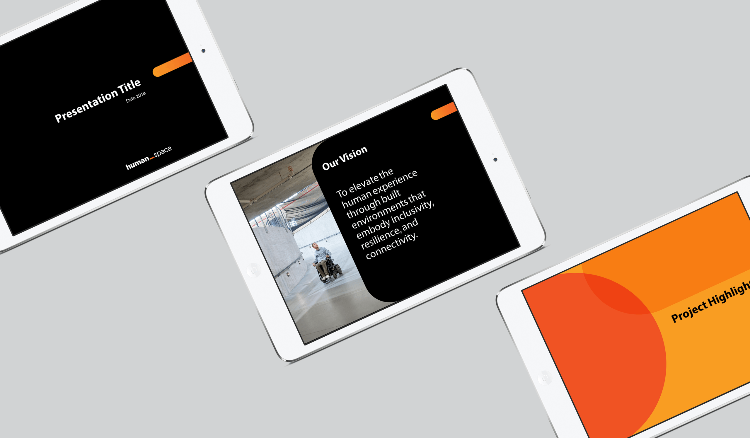 three tablets showing a Human Space presentation title page, a presentation slide titled "Our Vision" on black beside a photo of a man in a mobility device using a ramp, and a presentation slide "Project Highlights" on orange background with darker orange