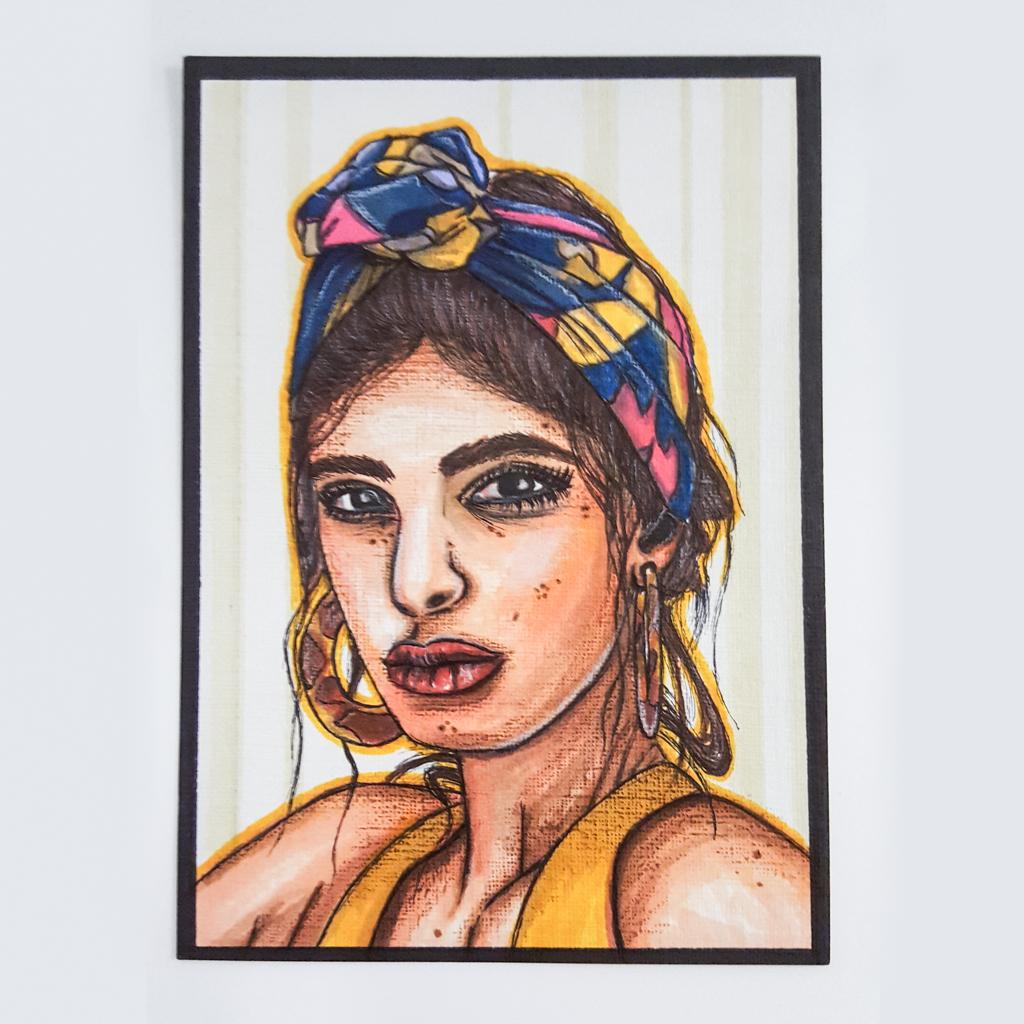 coloured pencil sketch of a young woman wearing a colourful head scarf and large hoop earrings