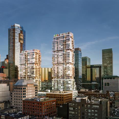 Focus on two boxy shaped high rise condo towers in downtown Toronto&#39;s skyline with the CN Tower in the background 